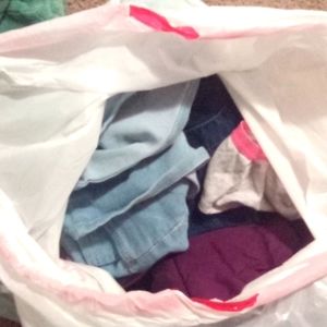 Full bag of kids clothes